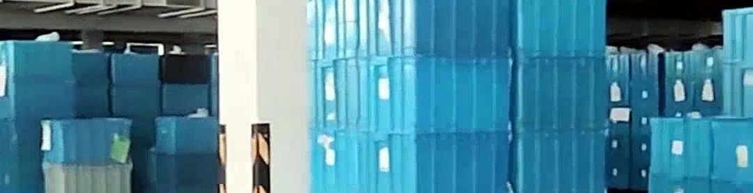 Warehouse with stacked crates of finished bottles